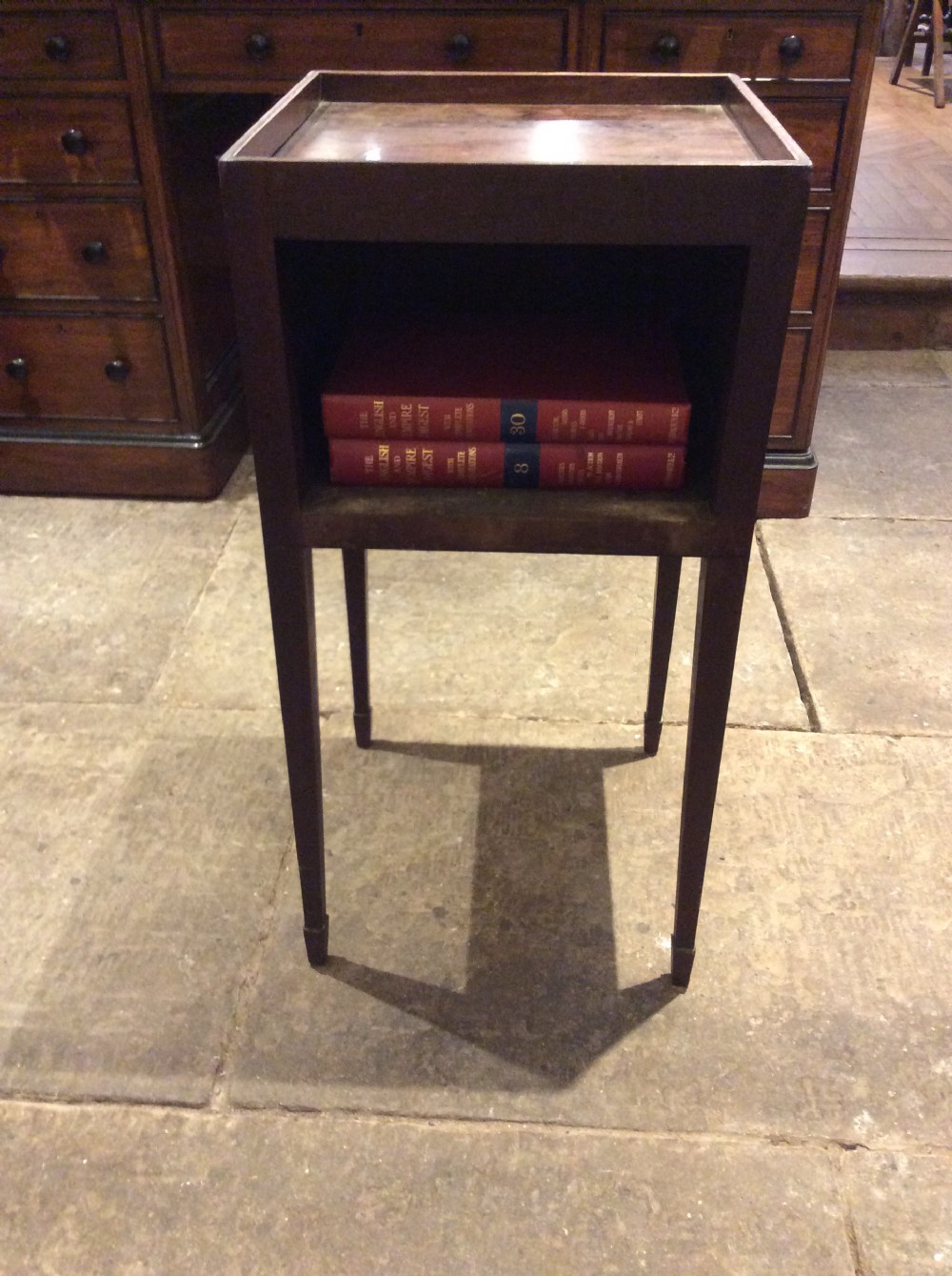 An 18th-century Georgian mahogany book table featuring a tray top gallery, an open compartment, and slender square tapered legs. View IX