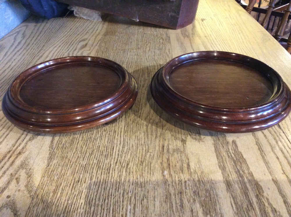 A near pair of mahogany coasters c.1820