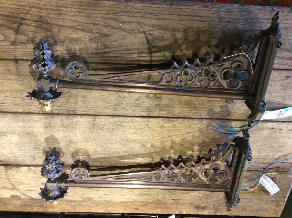 A pair of patinated dark brass Victorian Gothic wall light brackets featuring openwork tracery with trefoil motifs and detailed cast collars. View II