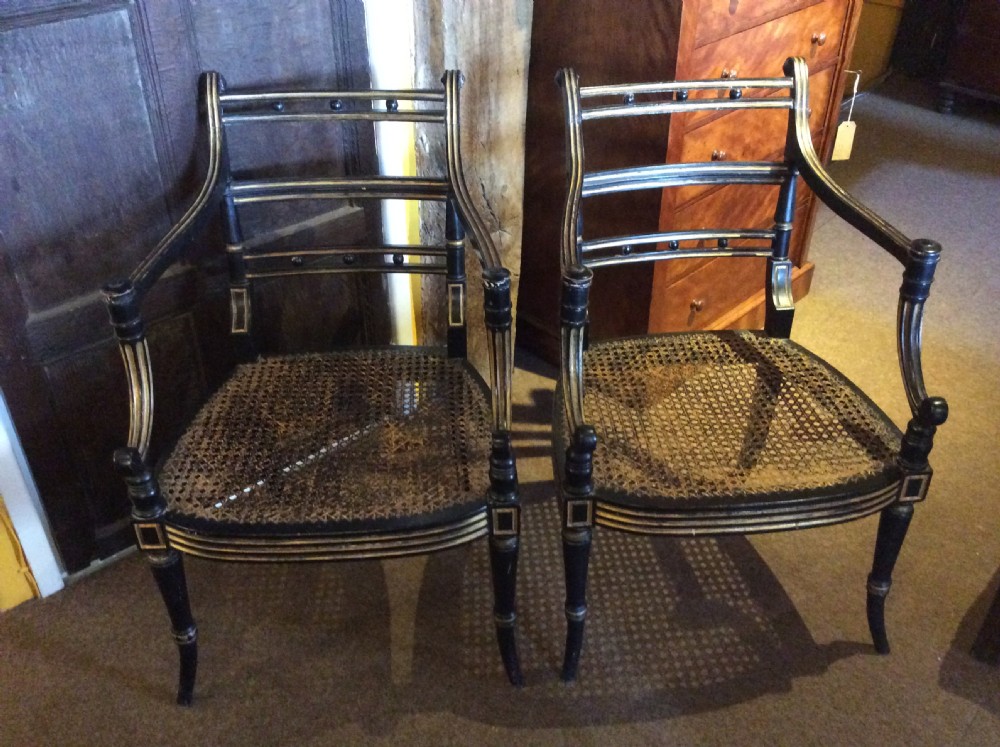 A pair  Regency ebonised caned chairs View III