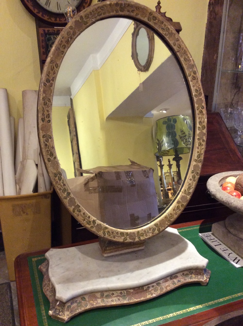 Decorated tilting table mirror on marble plinth View II