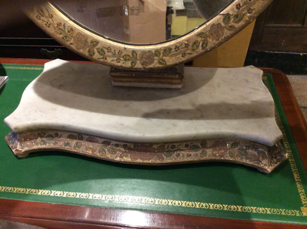 Decorated tilting table mirror on marble plinth View IV