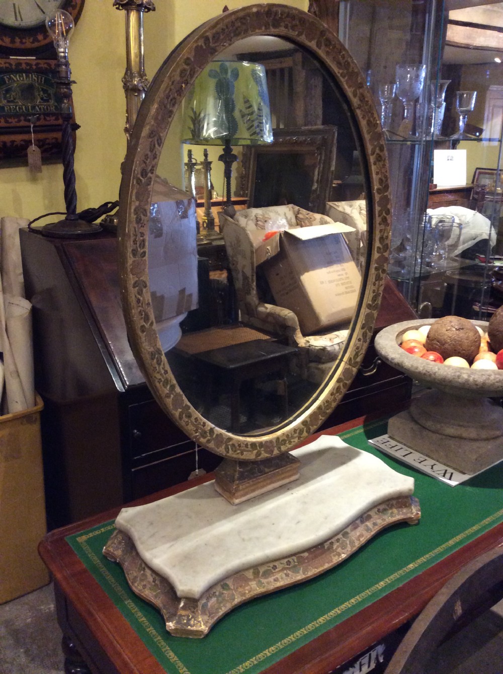 Decorated tilting table mirror on marble plinth View V
