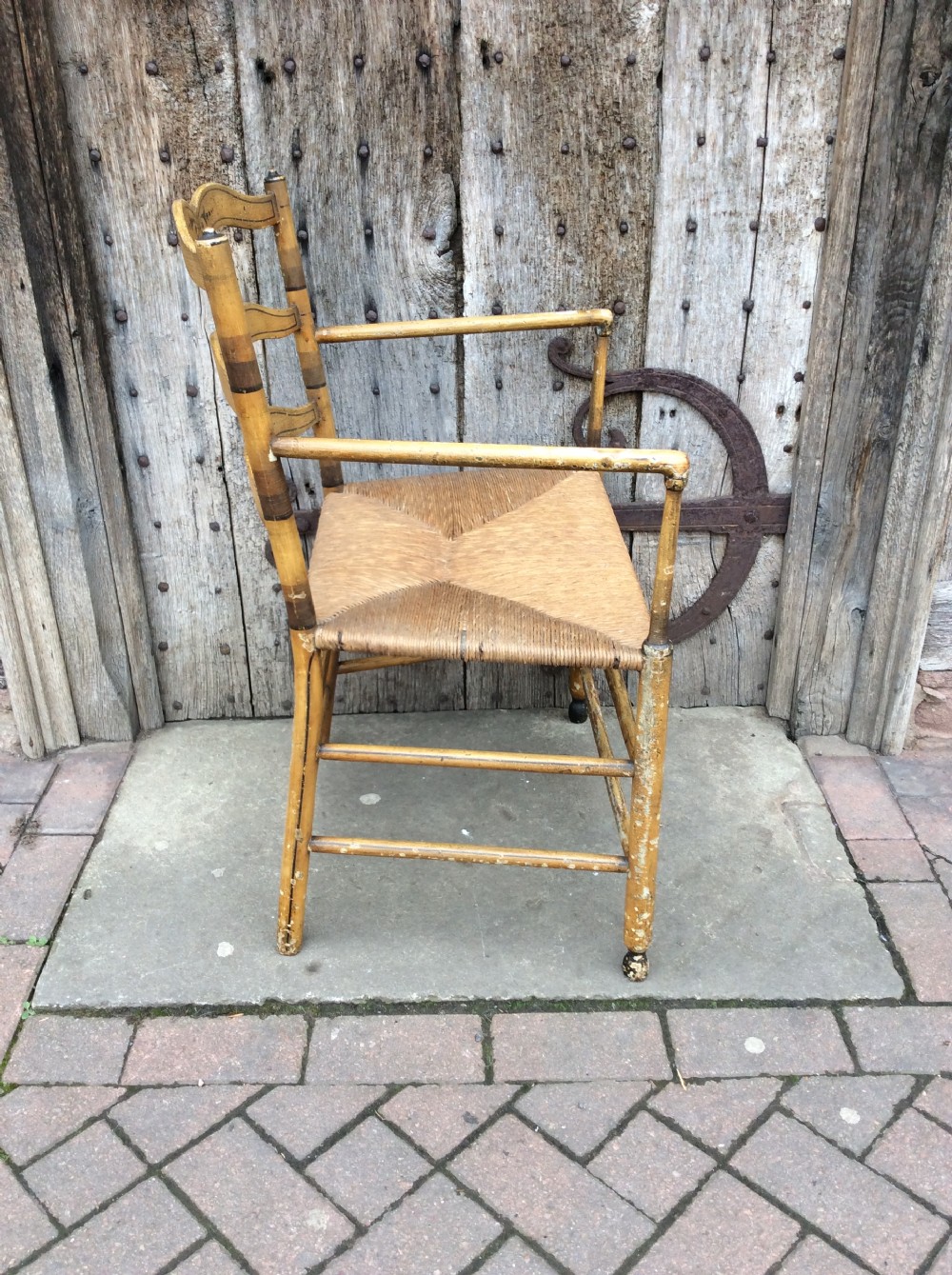 19thC Decorated rushed seat open arm armchair View V