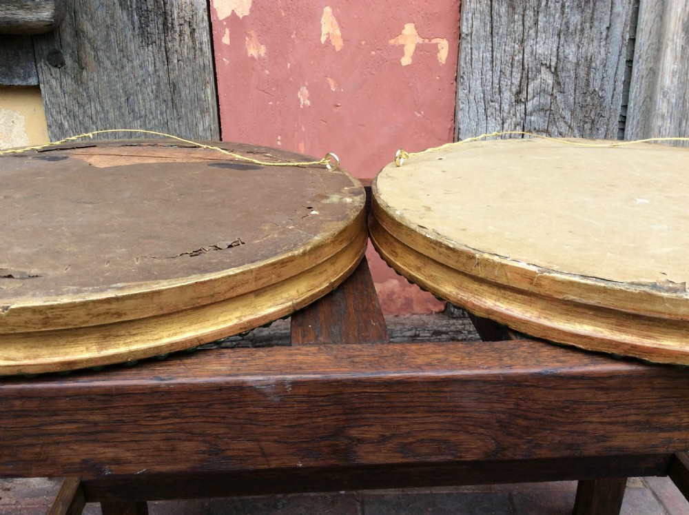 A 19thC Pair of decorated circular bevelled mirrors View V