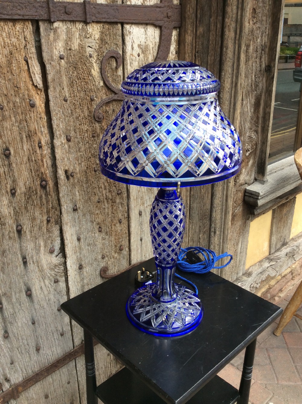A blue overlay cut glass table lamp View IV