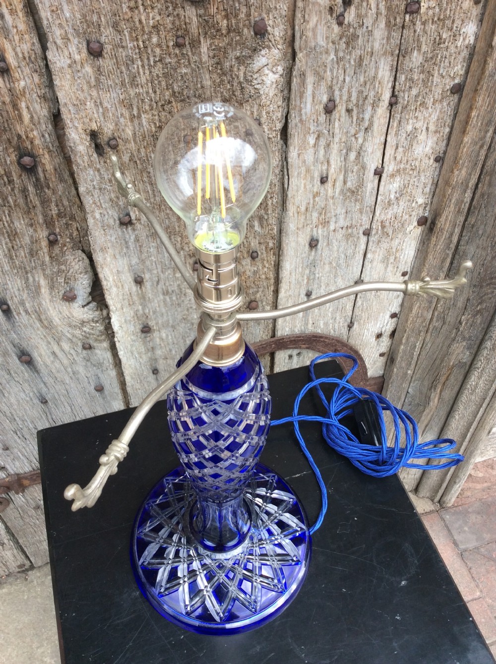 A blue overlay cut glass table lamp View IX