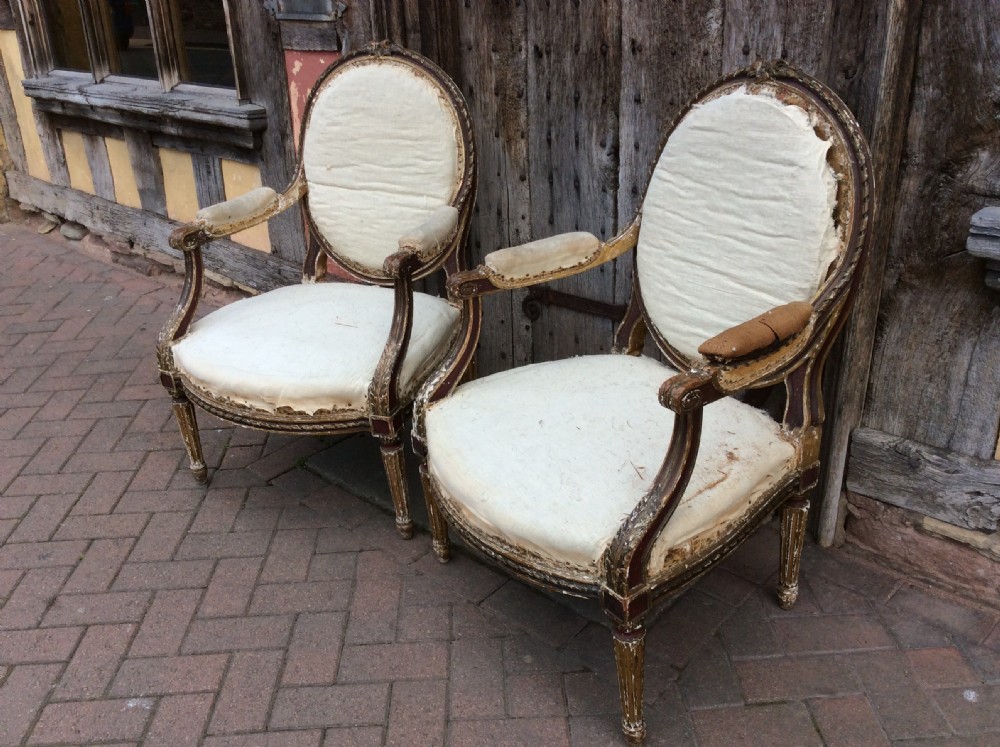 A pair of 19thC French country house elbow armchairs View II