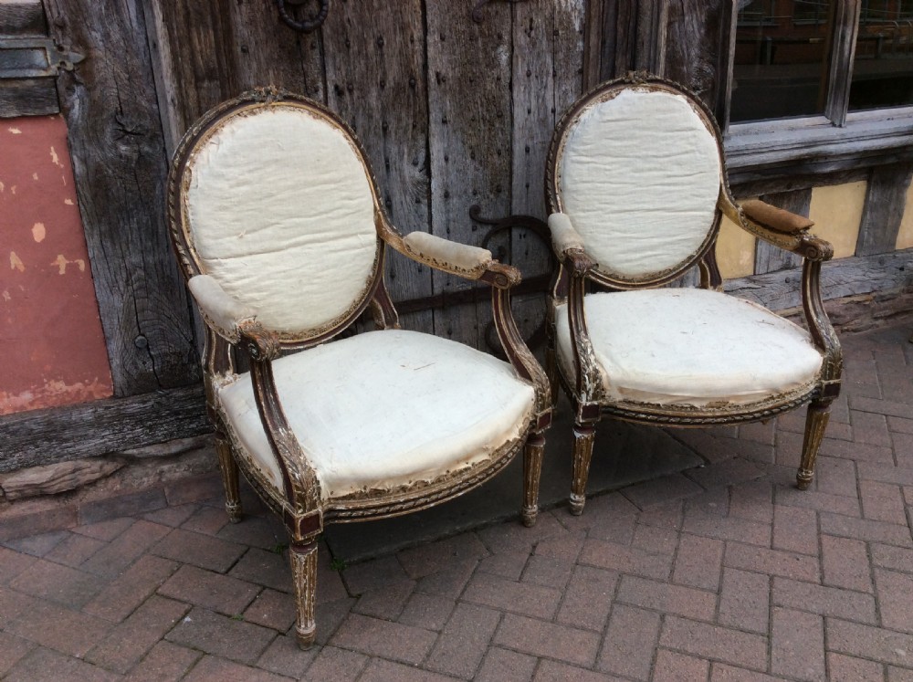 A pair of 19thC French country house elbow armchairs View III