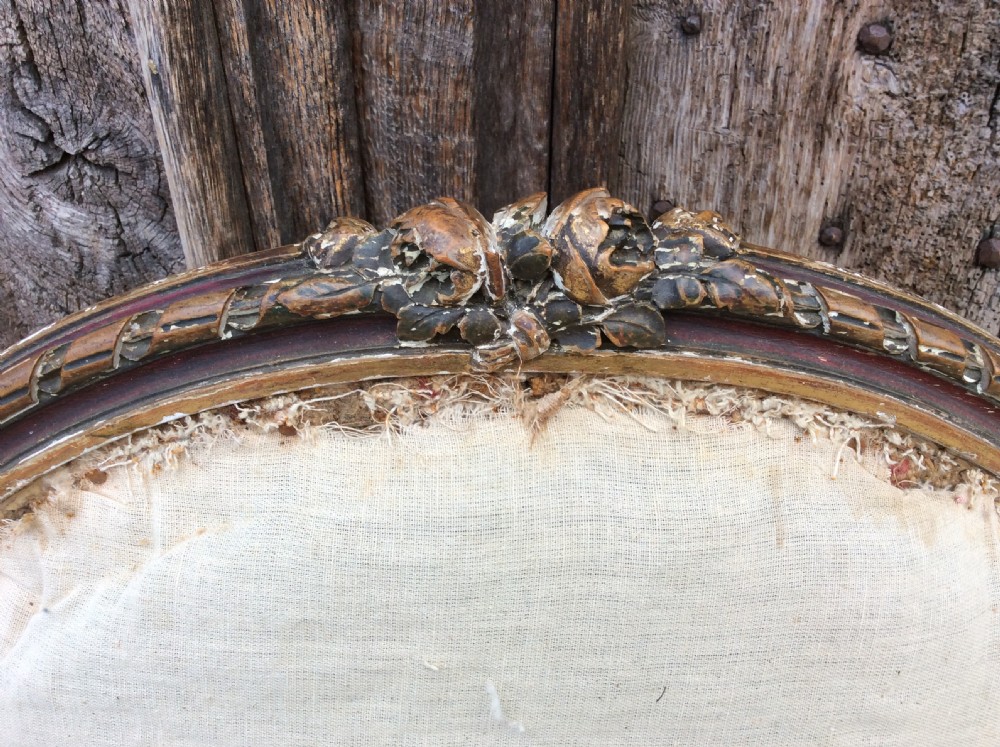 A pair of 19thC French country house elbow armchairs View V