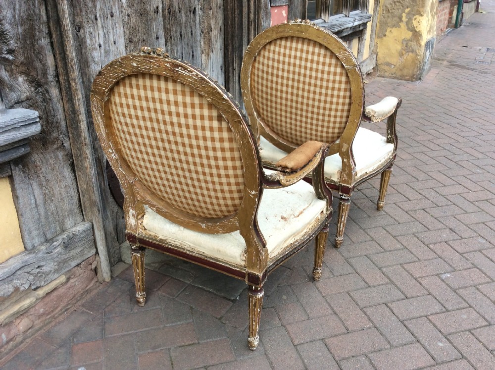 A pair of 19thC French country house elbow armchairs View VIII