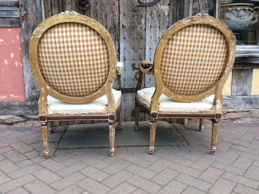 A pair of 19thC French country house elbow armchairs View X