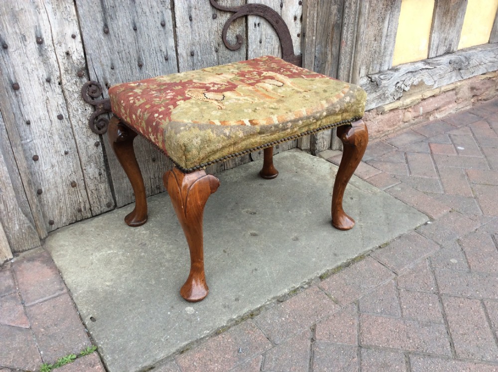 A 19thc walnut cabriole leg stool