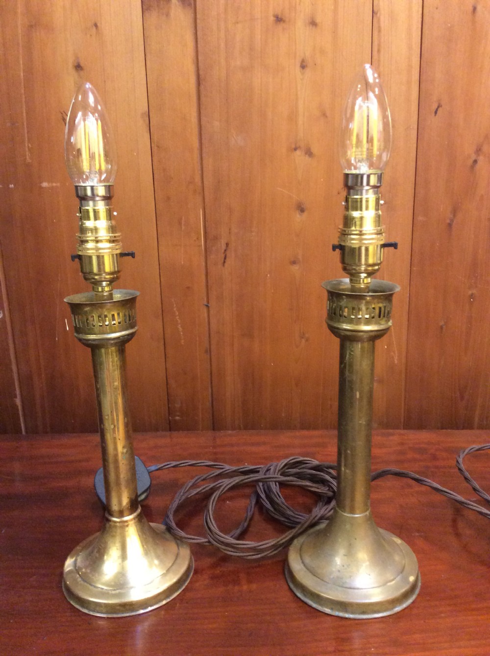 A pair of Edwardian brass table lamps