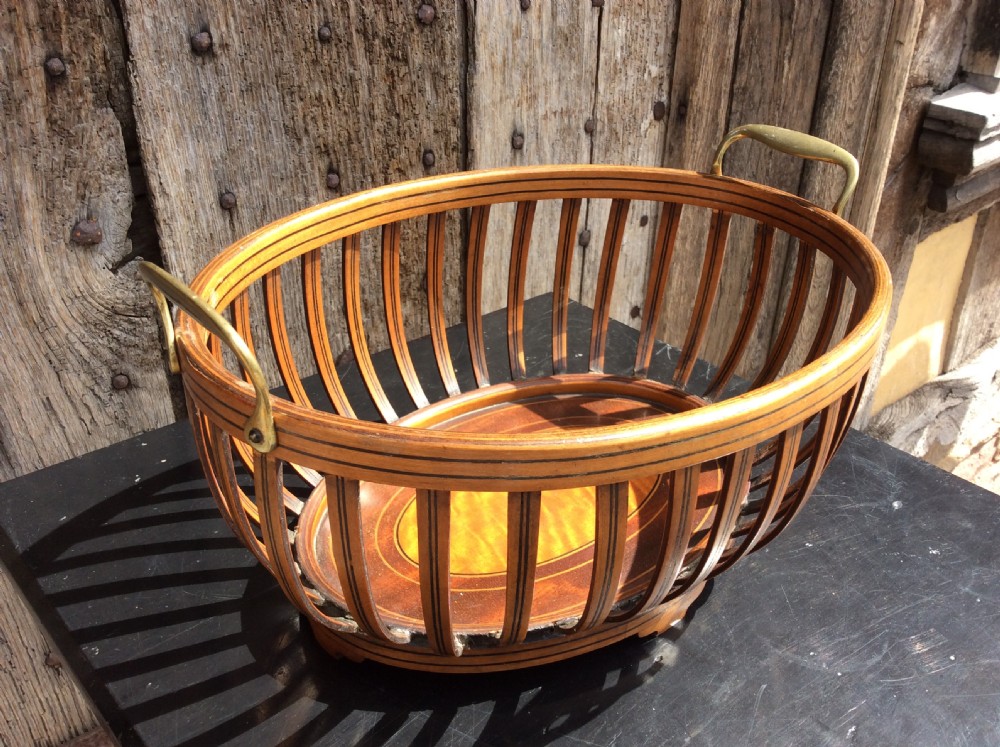 An Edwardian mahogany bread basket