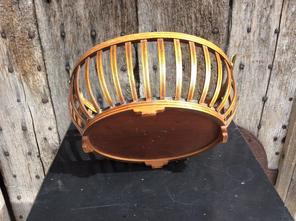 An Edwardian mahogany bread basket View V