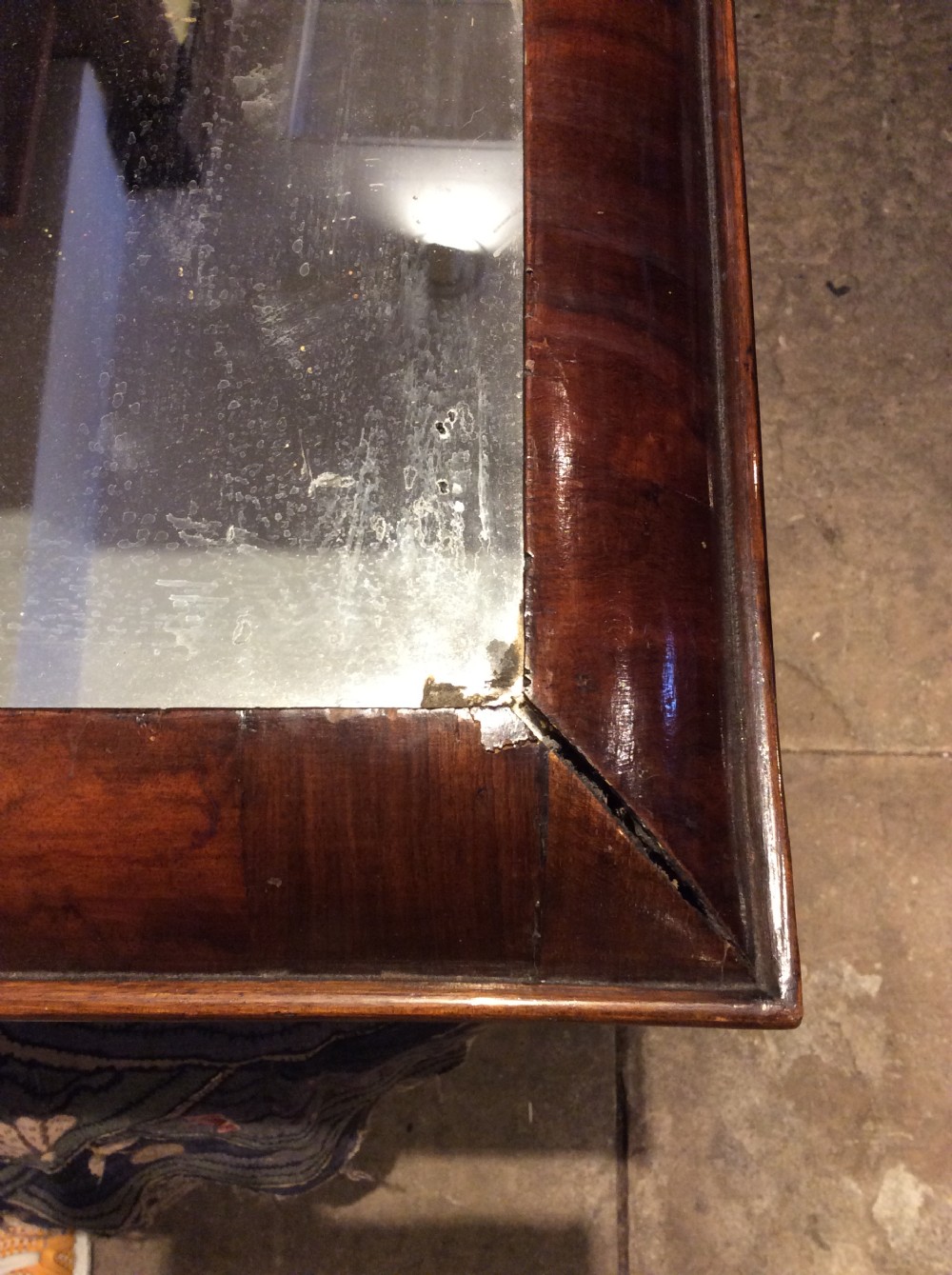 An 18thC Verneered walnut cushion mirror View II