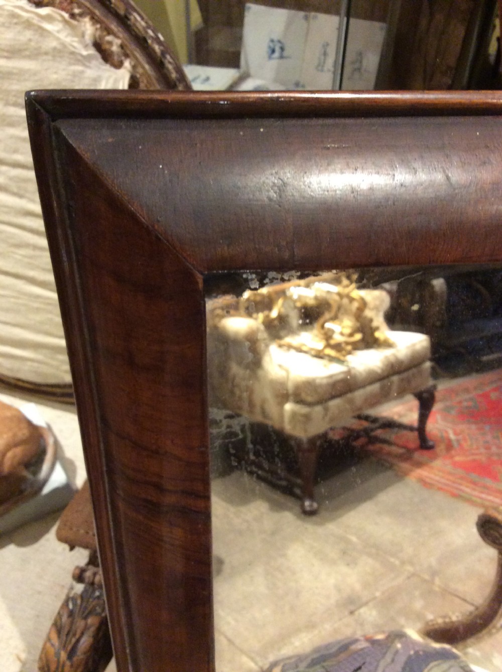 An 18thC Verneered walnut cushion mirror View III