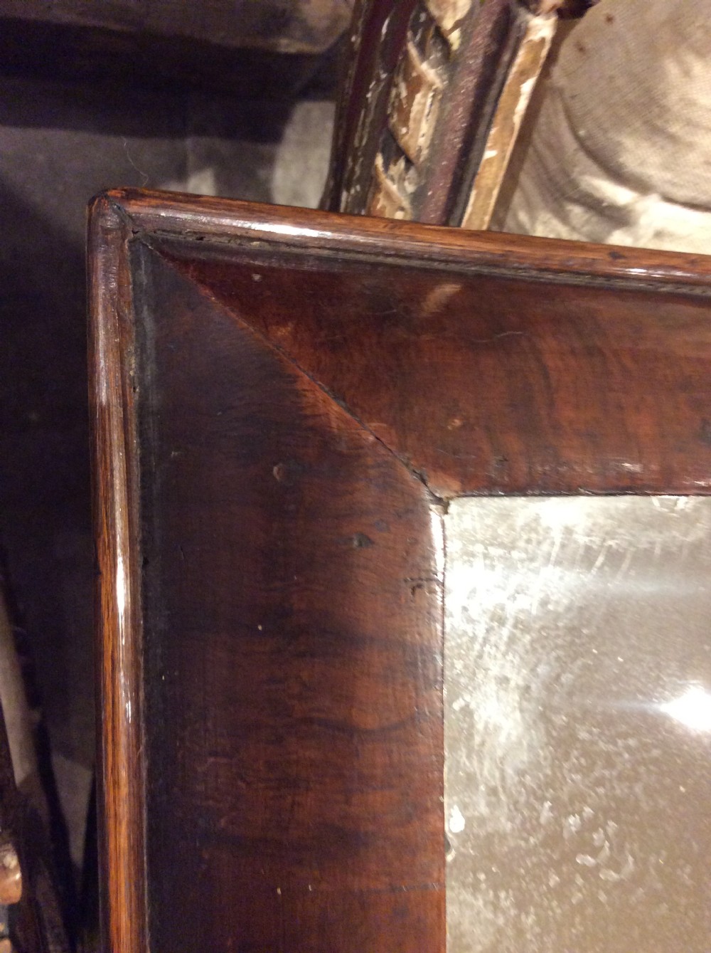 An 18thC Verneered walnut cushion mirror View VI