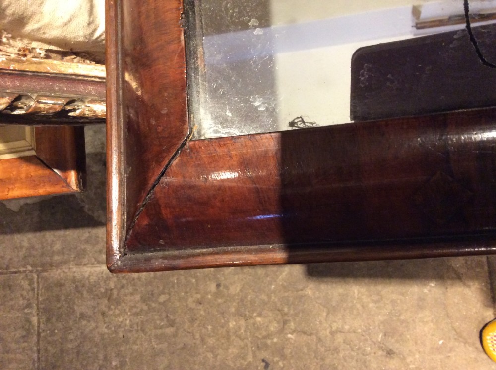 An 18thC Verneered walnut cushion mirror View VIII