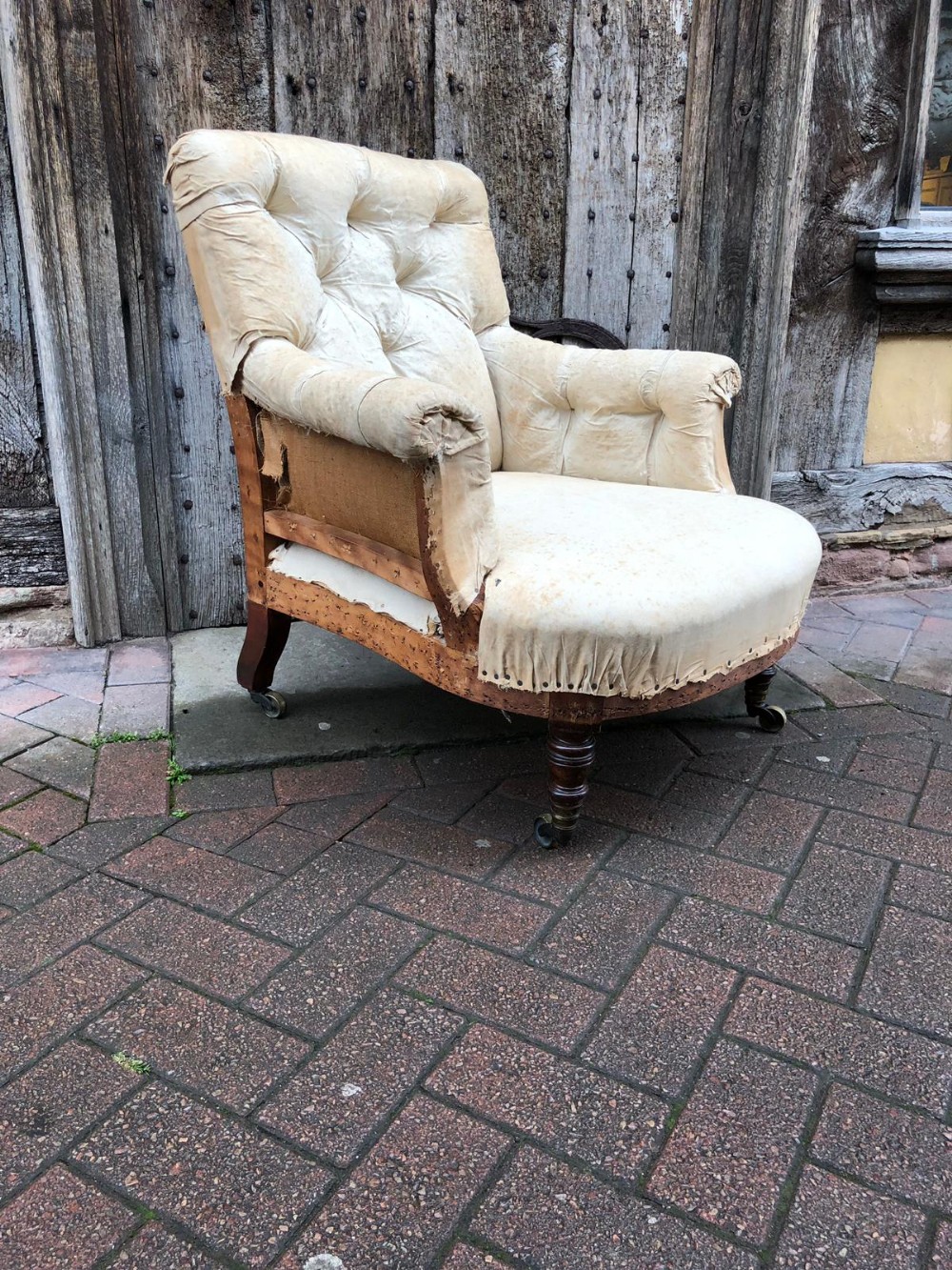 A 19thC turned legs country house armchair by Howard and Sons