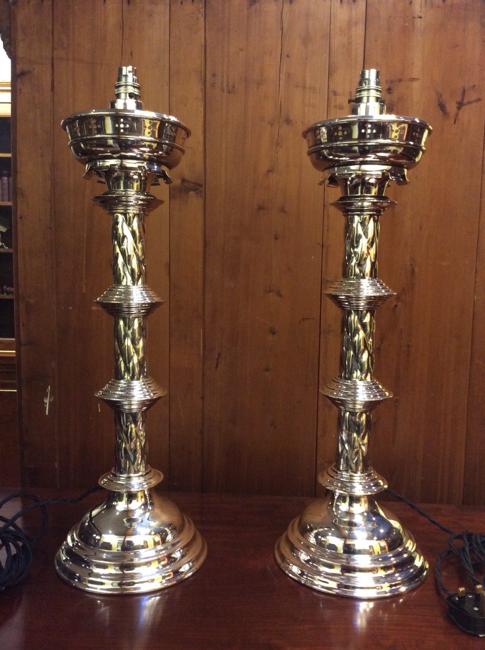 A pair of Edwardian silver plated converted Gothic candlesticks View II