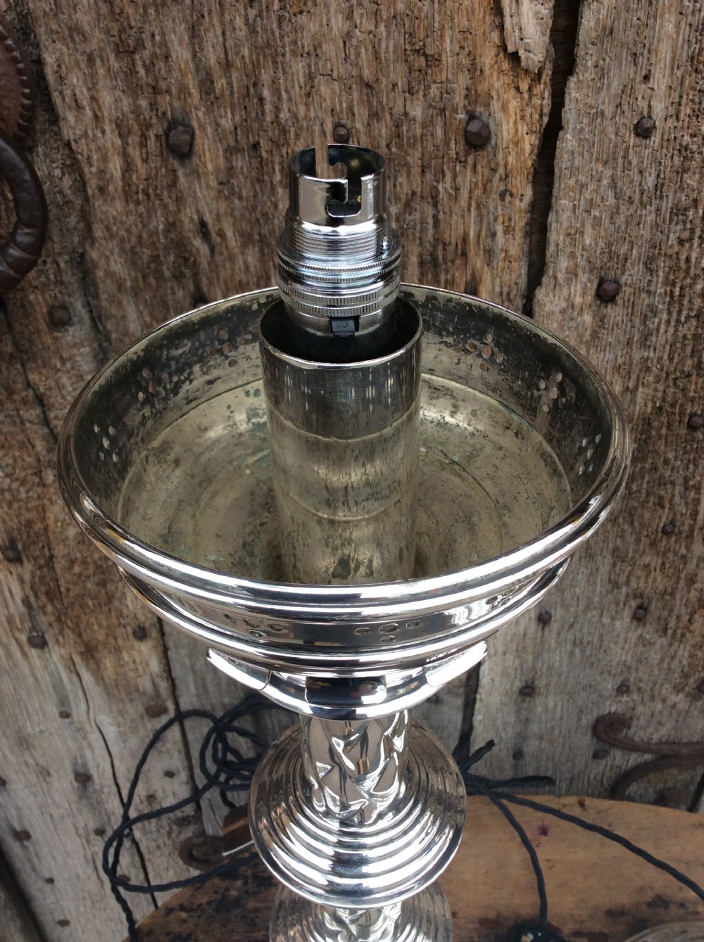 A pair of Edwardian silverplated converted Gothic candlesticks View II