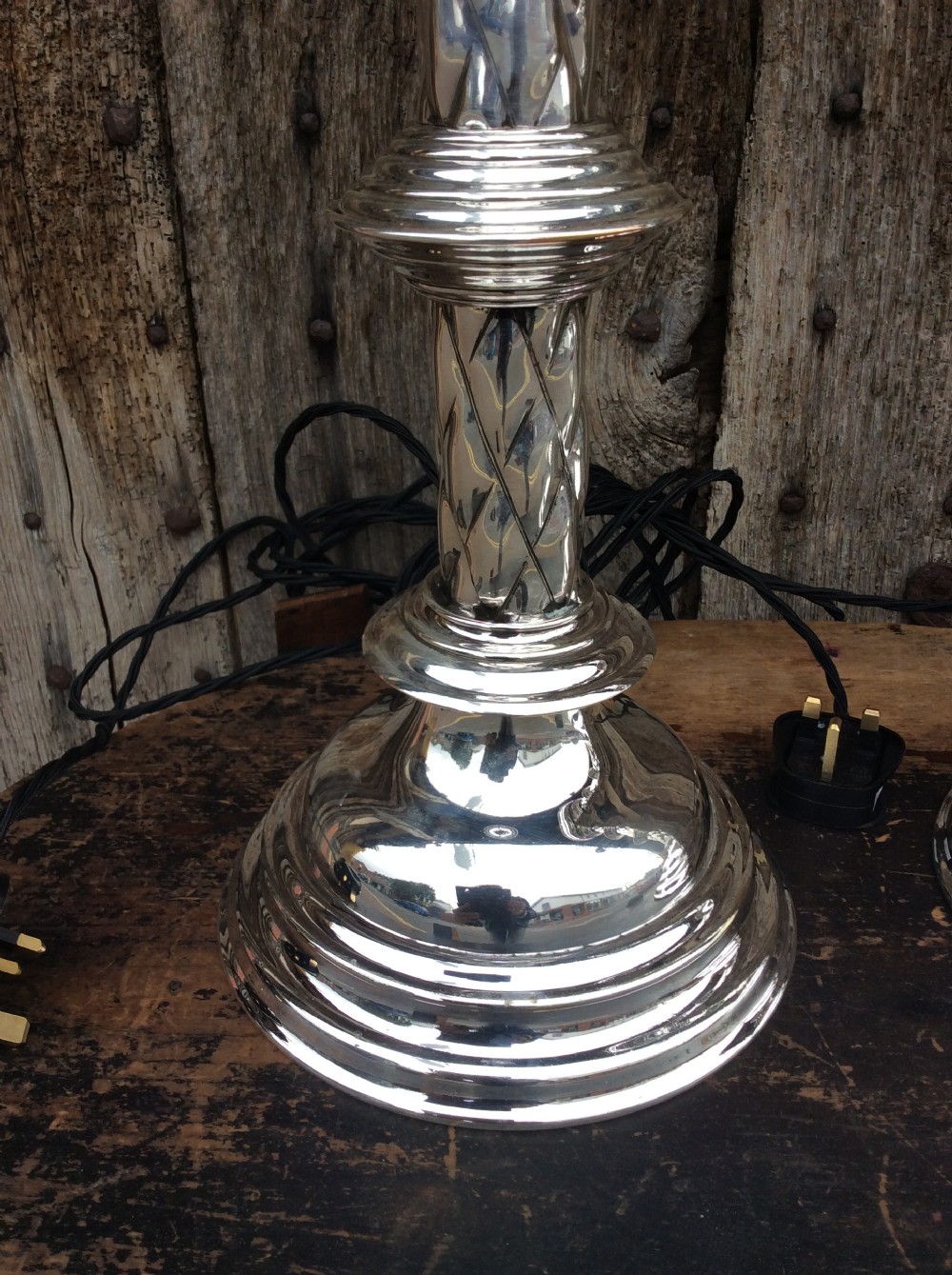A pair of Edwardian silverplated converted Gothic candlesticks View V