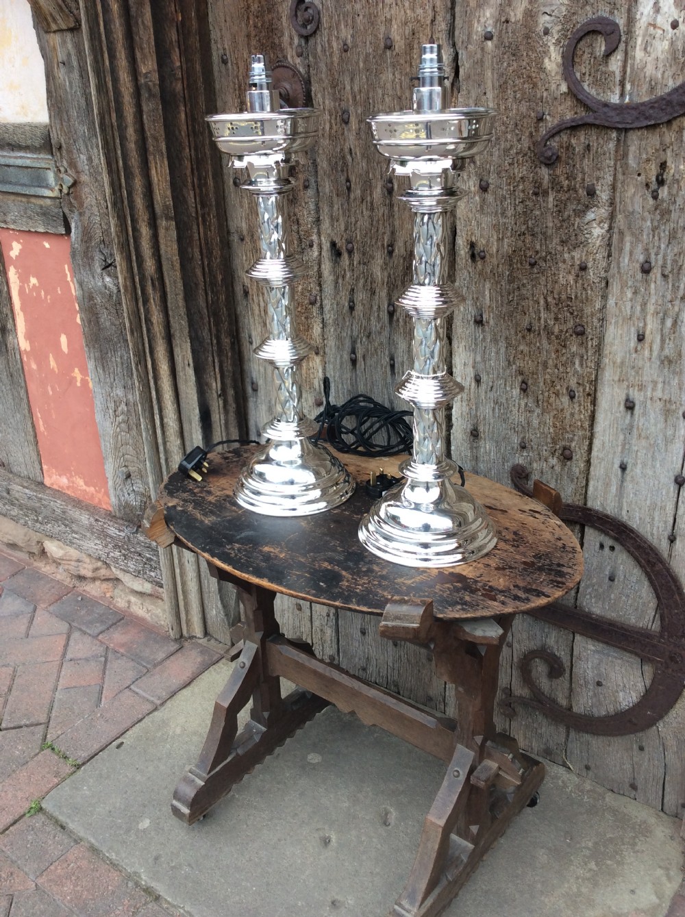 A pair of Edwardian silverplated converted Gothic candlesticks View VII