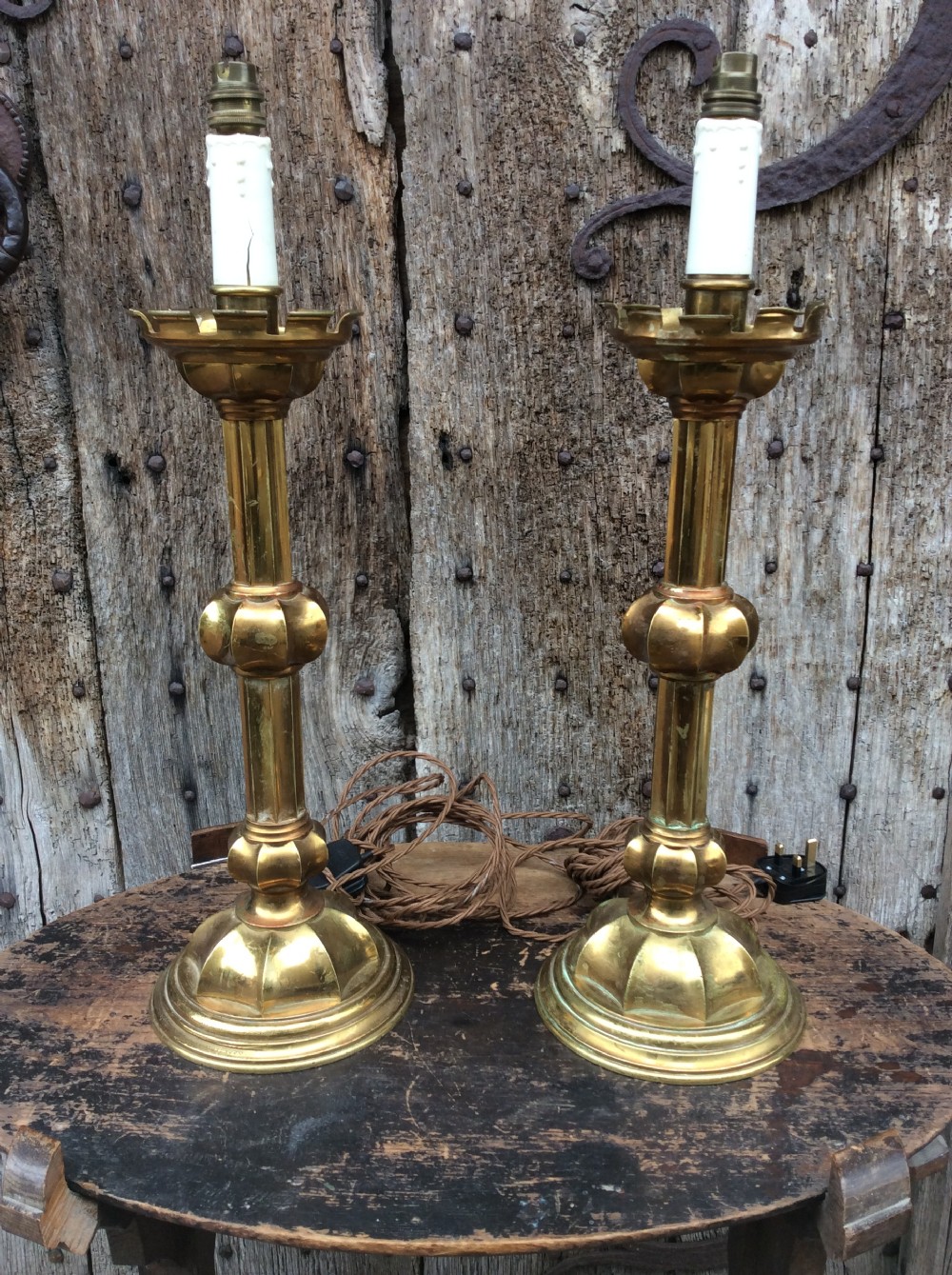 A pair of Gothic revival brass table lamps
