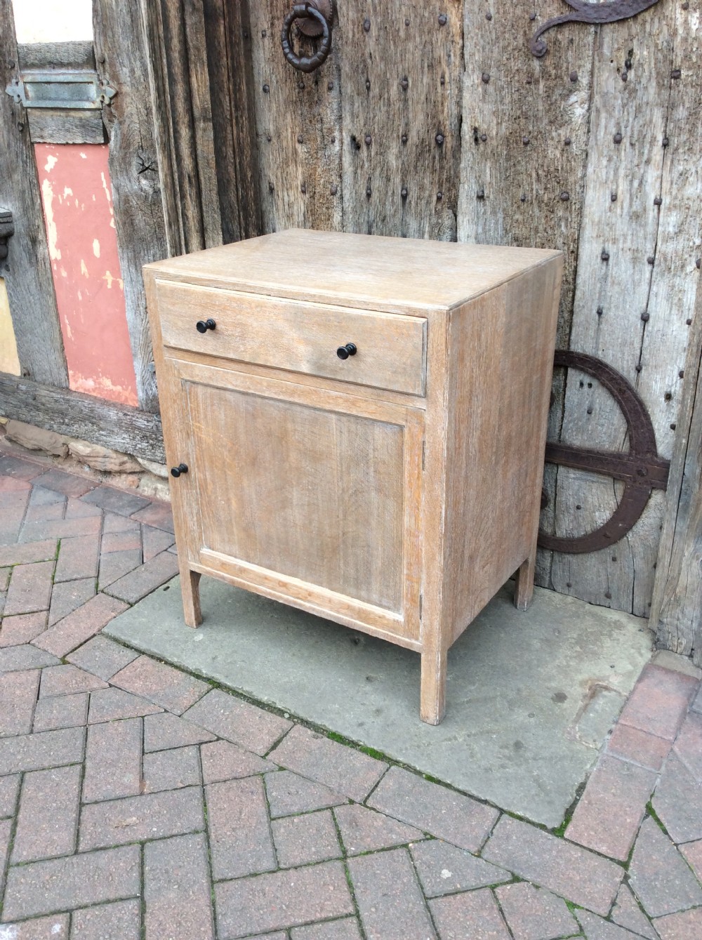A 20thC light oak Heals cupboard View II