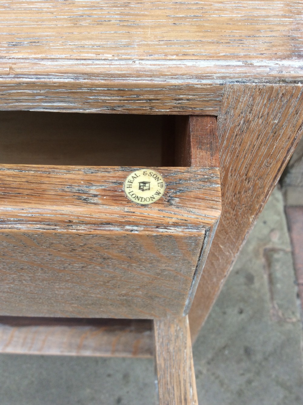 A 20thC light oak Heals cupboard View IV