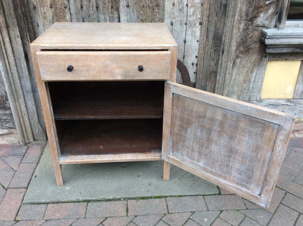 A 20thC light oak Heals cupboard View V