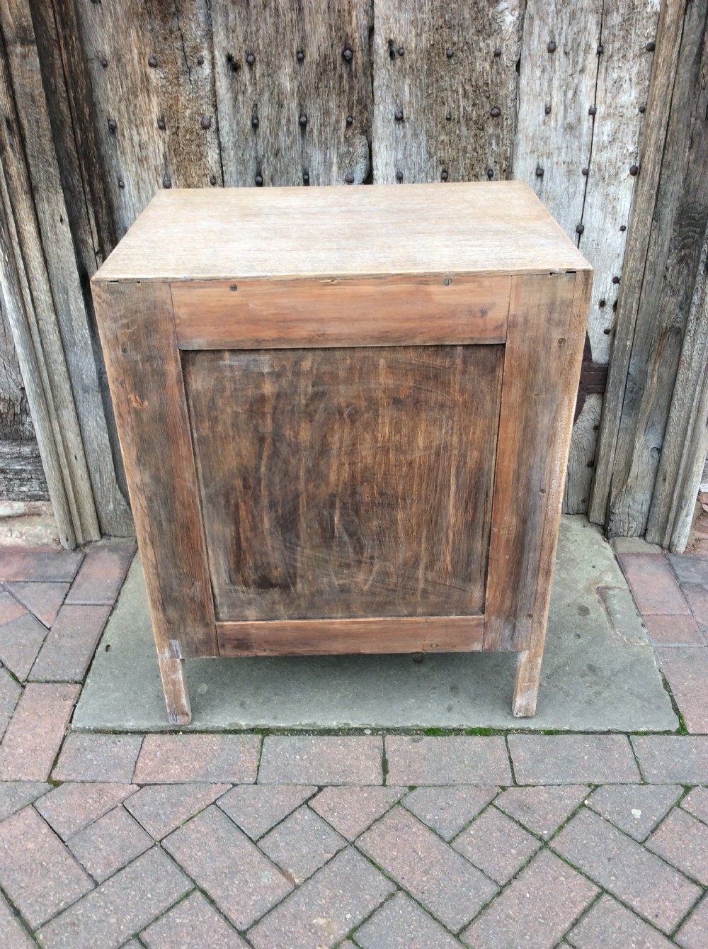 A 20thC light oak Heals cupboard View VII