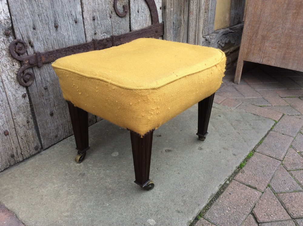 An Edwardian mahogany footstool View II