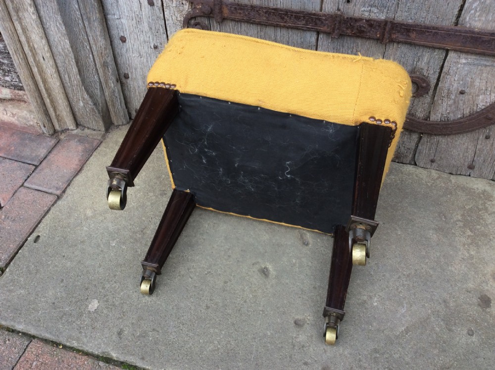 An Edwardian mahogany footstool View V