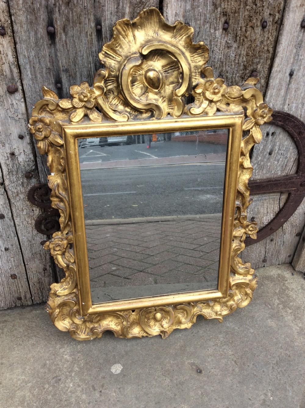 An 18thC Italian carved & gilded mirror