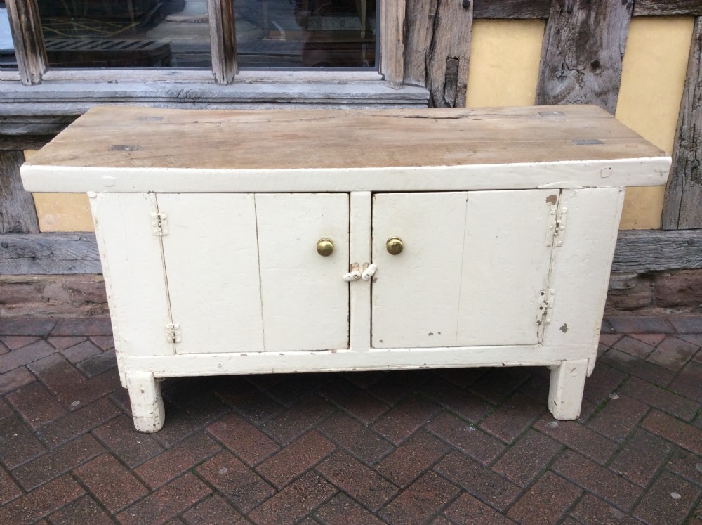 A 19thC painted pine and elm primitive cupboard