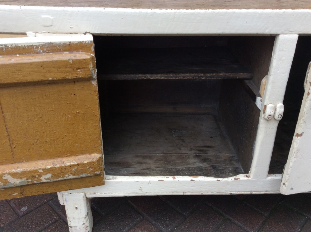 A 19thC painted pine and elm primitive cupboard View VI