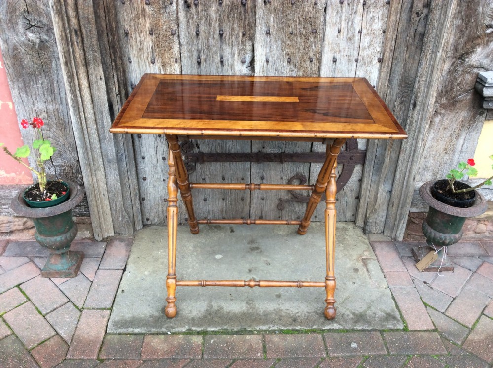 A 19thC Coaching table in rosewood and birds eye maple