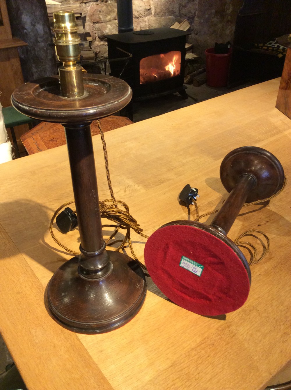 A pair of Edwardian candlestick oak lamps View IV