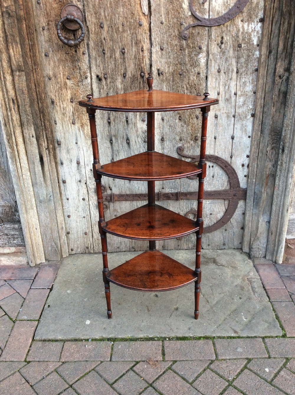 An early 19thC mahogany 4 tier corner whatnot