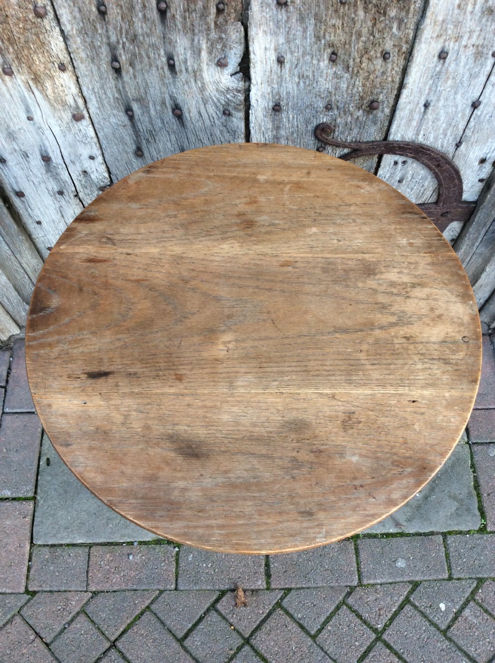An early 20thC oak cricket table View III