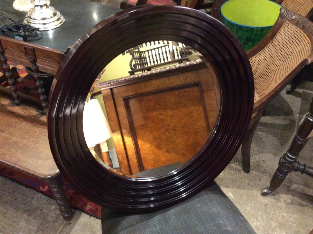 An Art Deco lacquered circular mirror View III