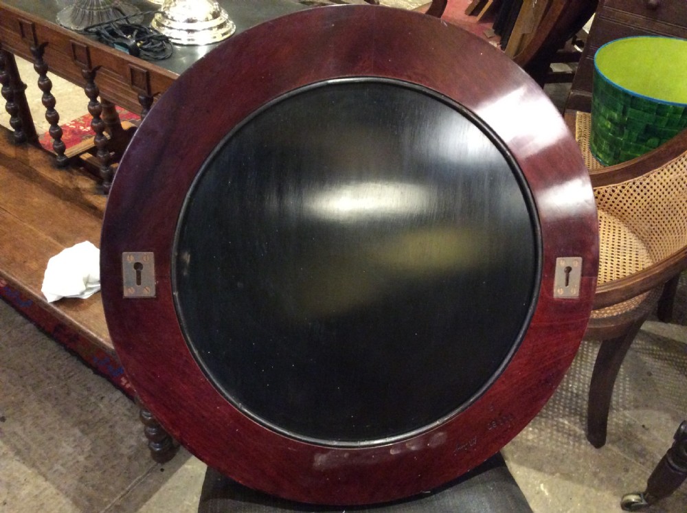 An Art Deco lacquered circular mirror View V