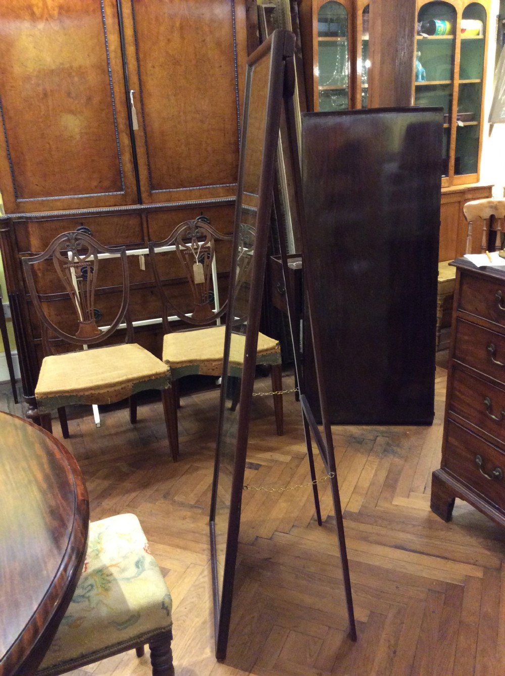 A free standing mahogany mirror  View II