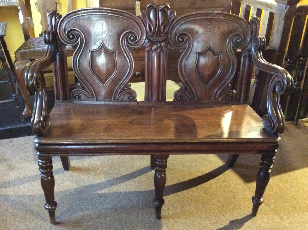 A 19thC carved oak bench