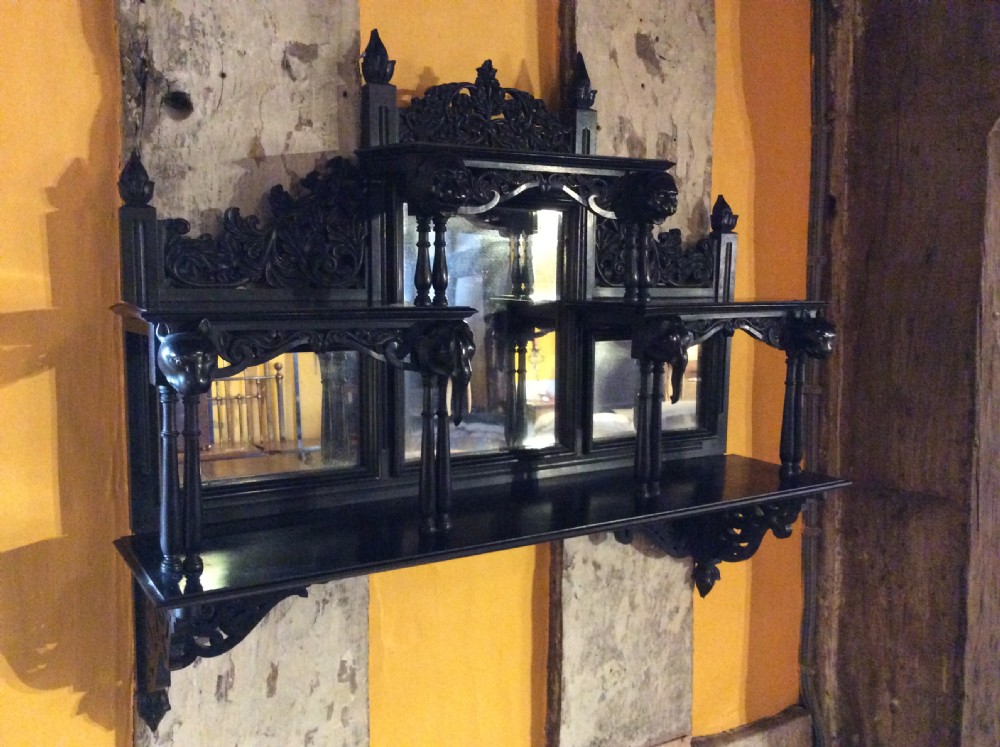 A 19thC Ceylonese ebony mirrored set of wall shelves