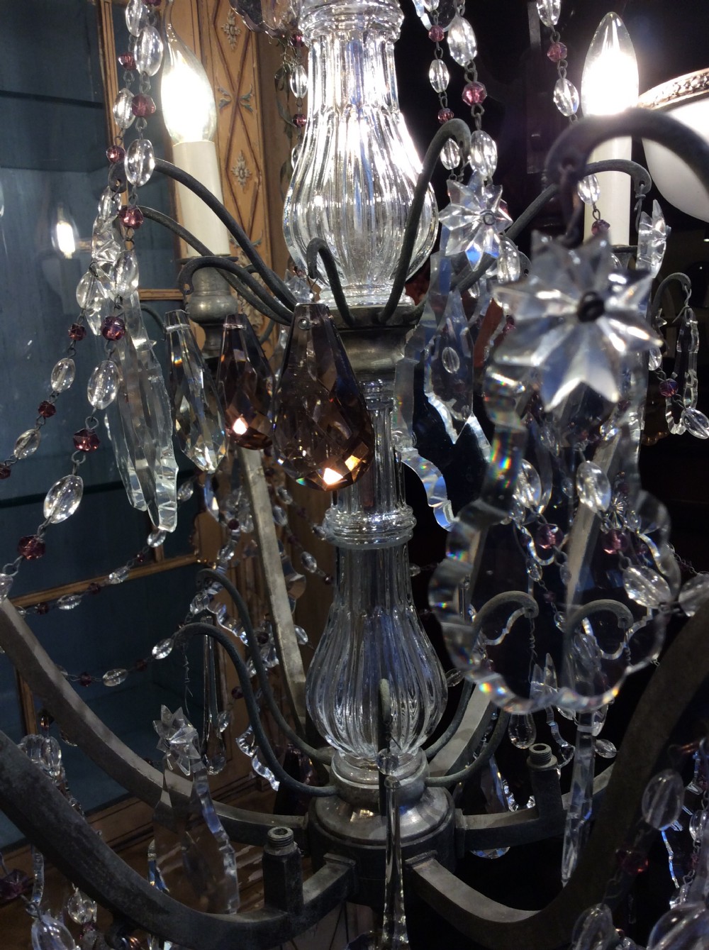 A nineteenth-century six-light chandelier featuring a central cut-glass baluster, curved metal arms, candle-style bulb holders, and cascading crystal drops. View VIII