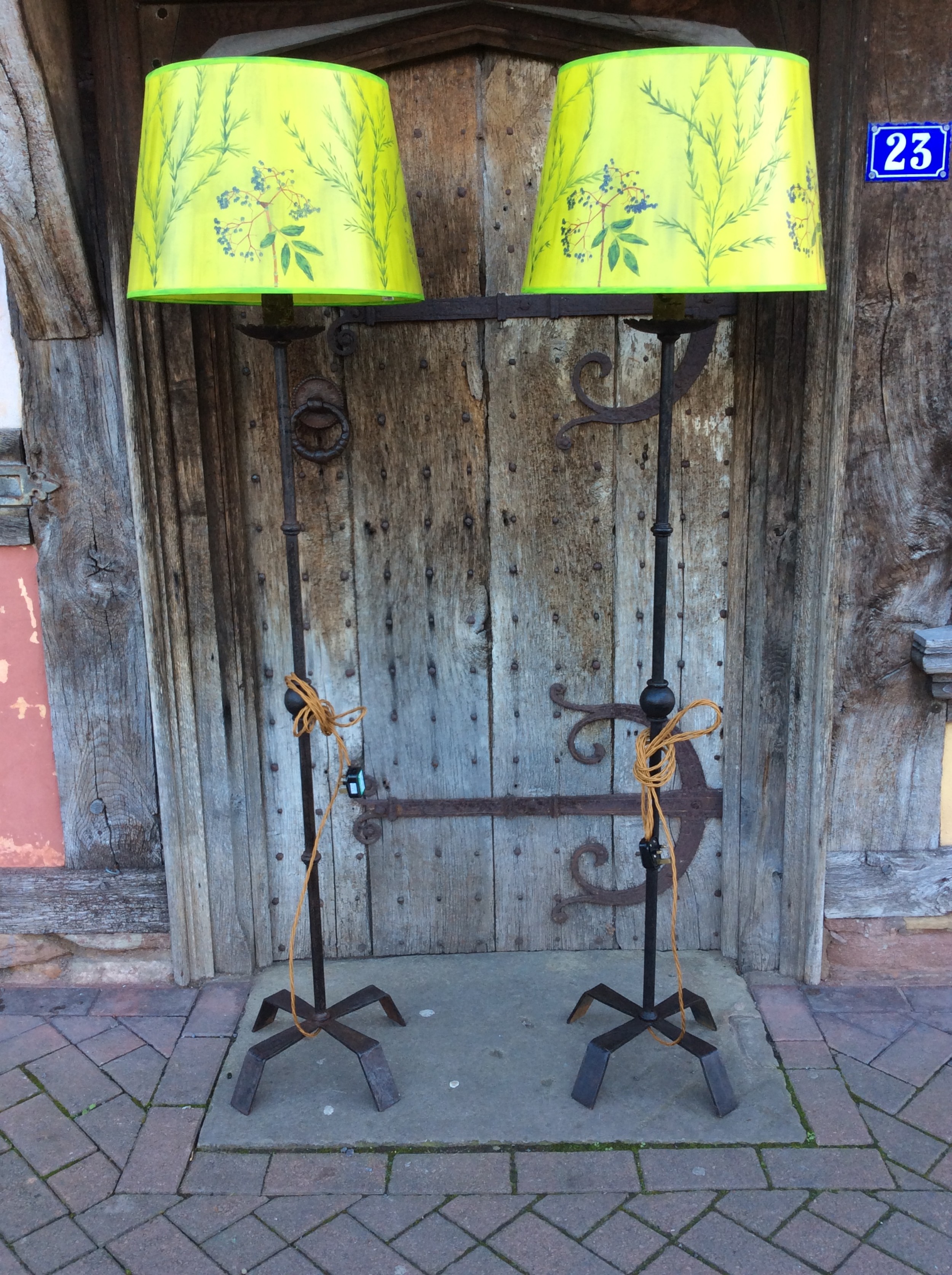 A pair of early 20thC steel standard lamps